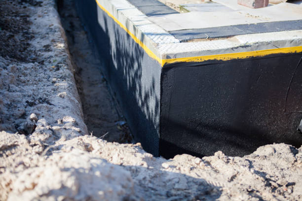 Professional Basement Waterproofing technician working in West Union, OH